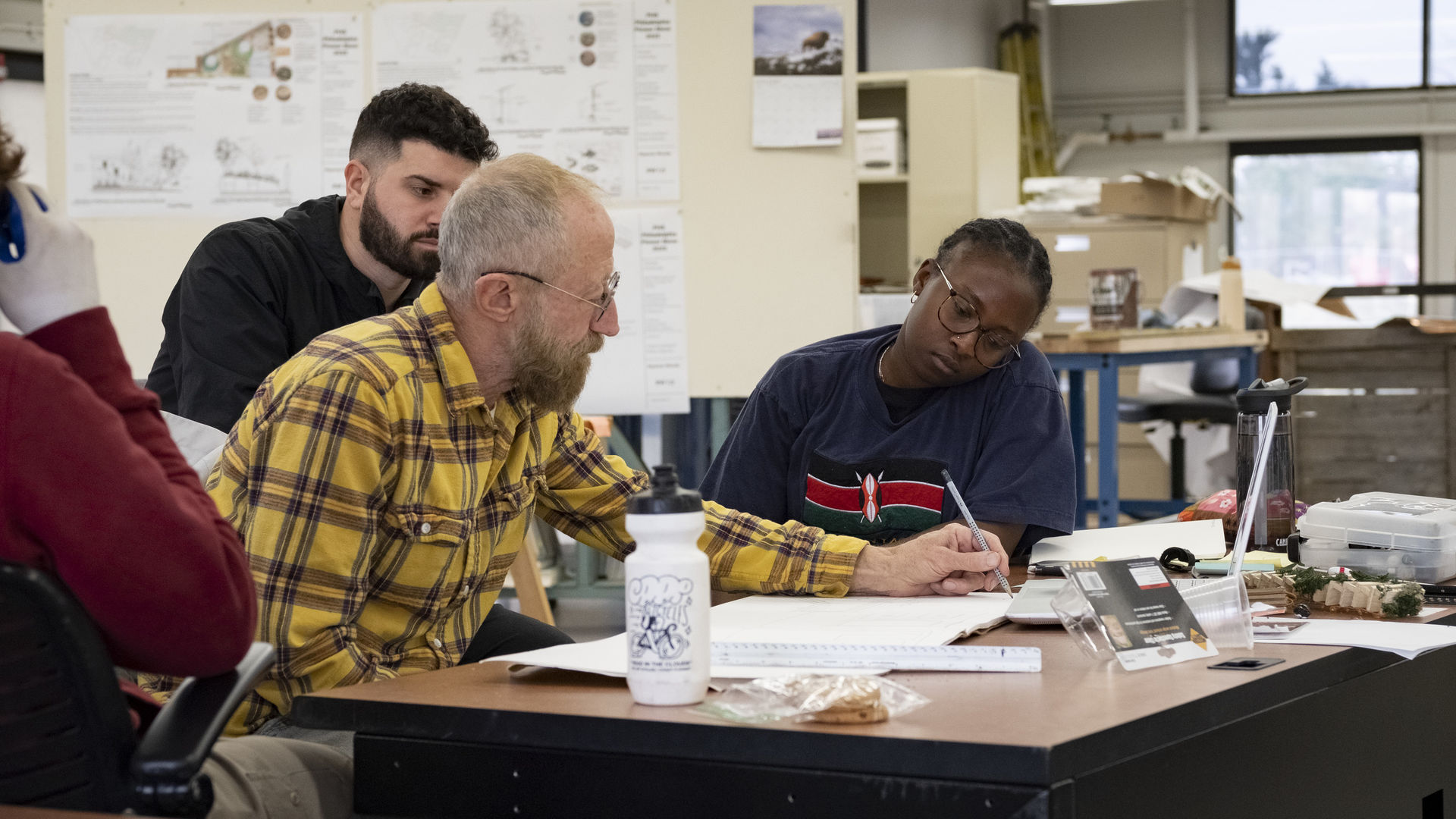 Tyler faculty works with students on Flower Show design. 