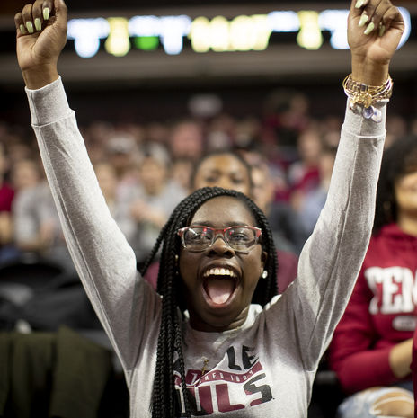 Student cheering at Temple athletics game