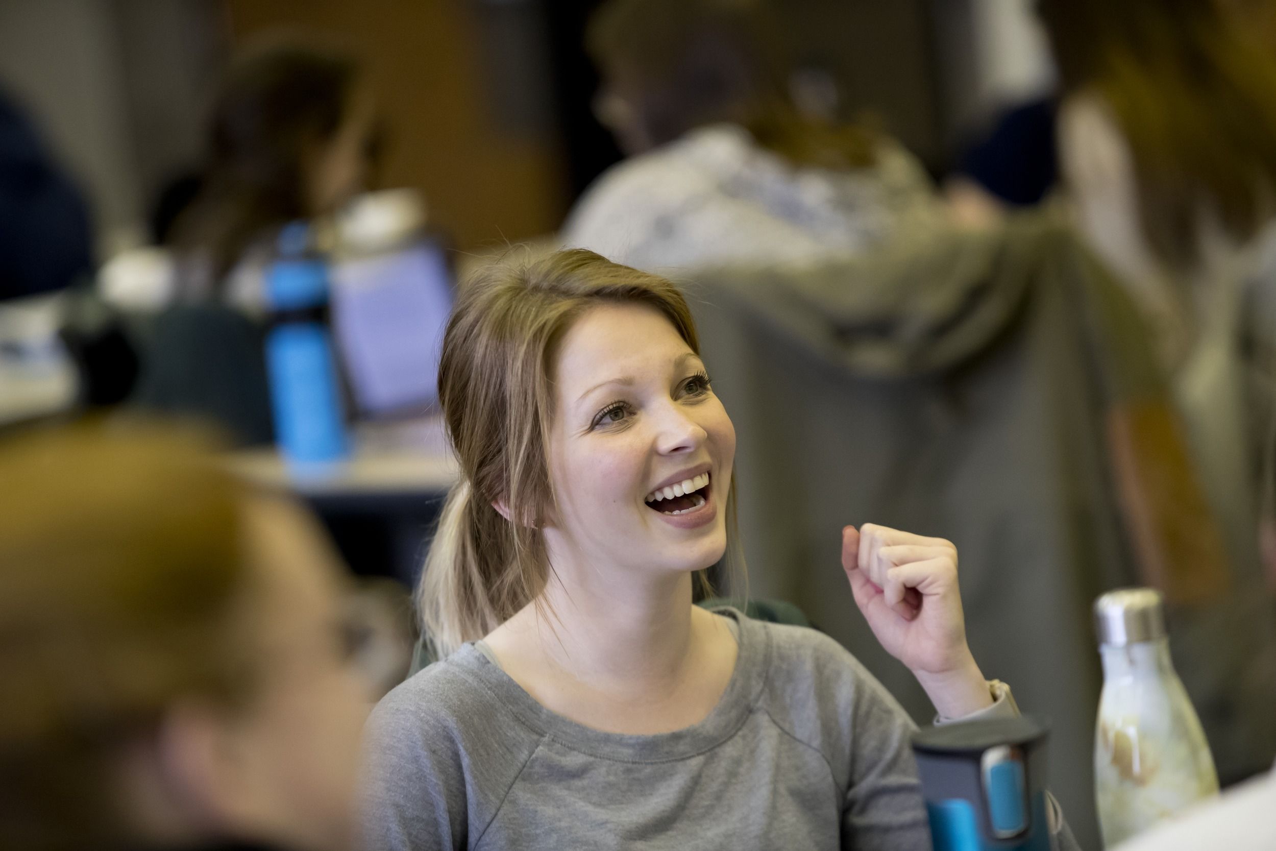 College of Public Health students talk during class. 