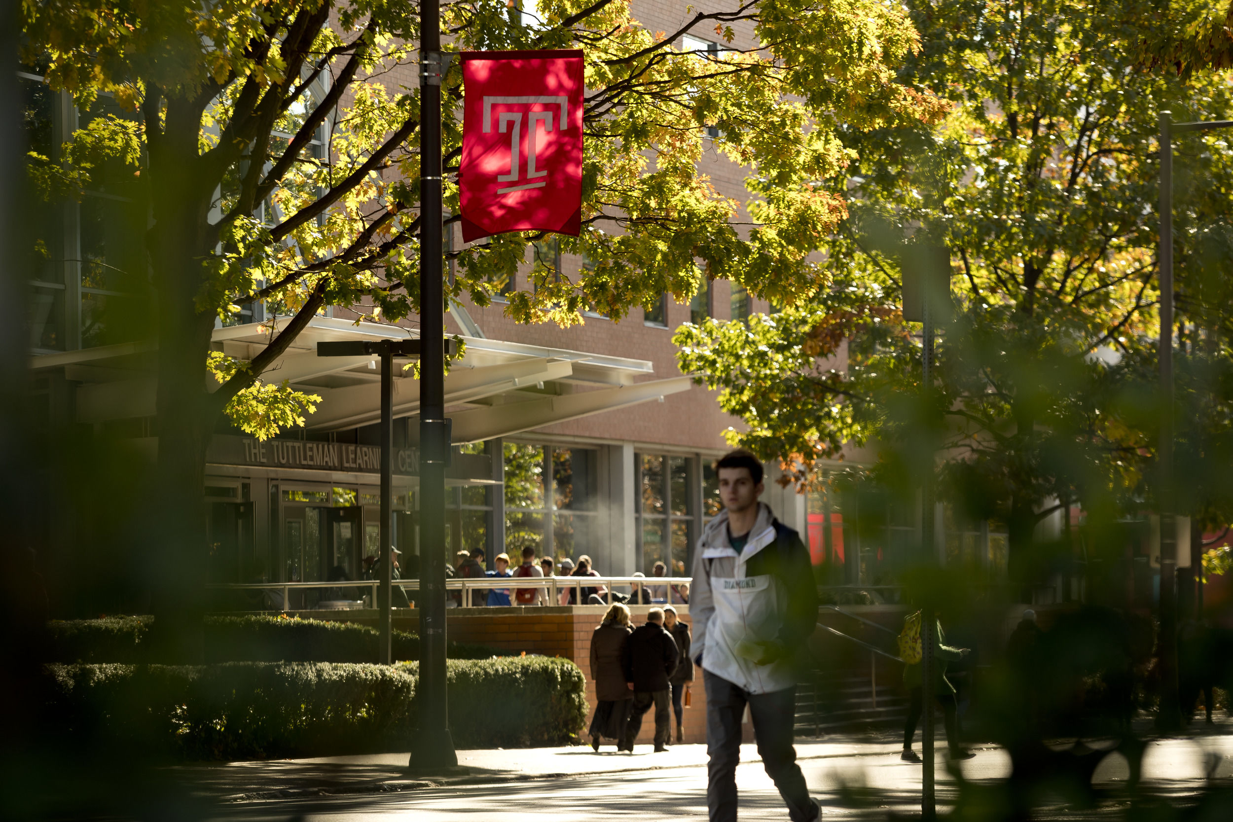 Students walking by the Tuttleman Learning Center. 