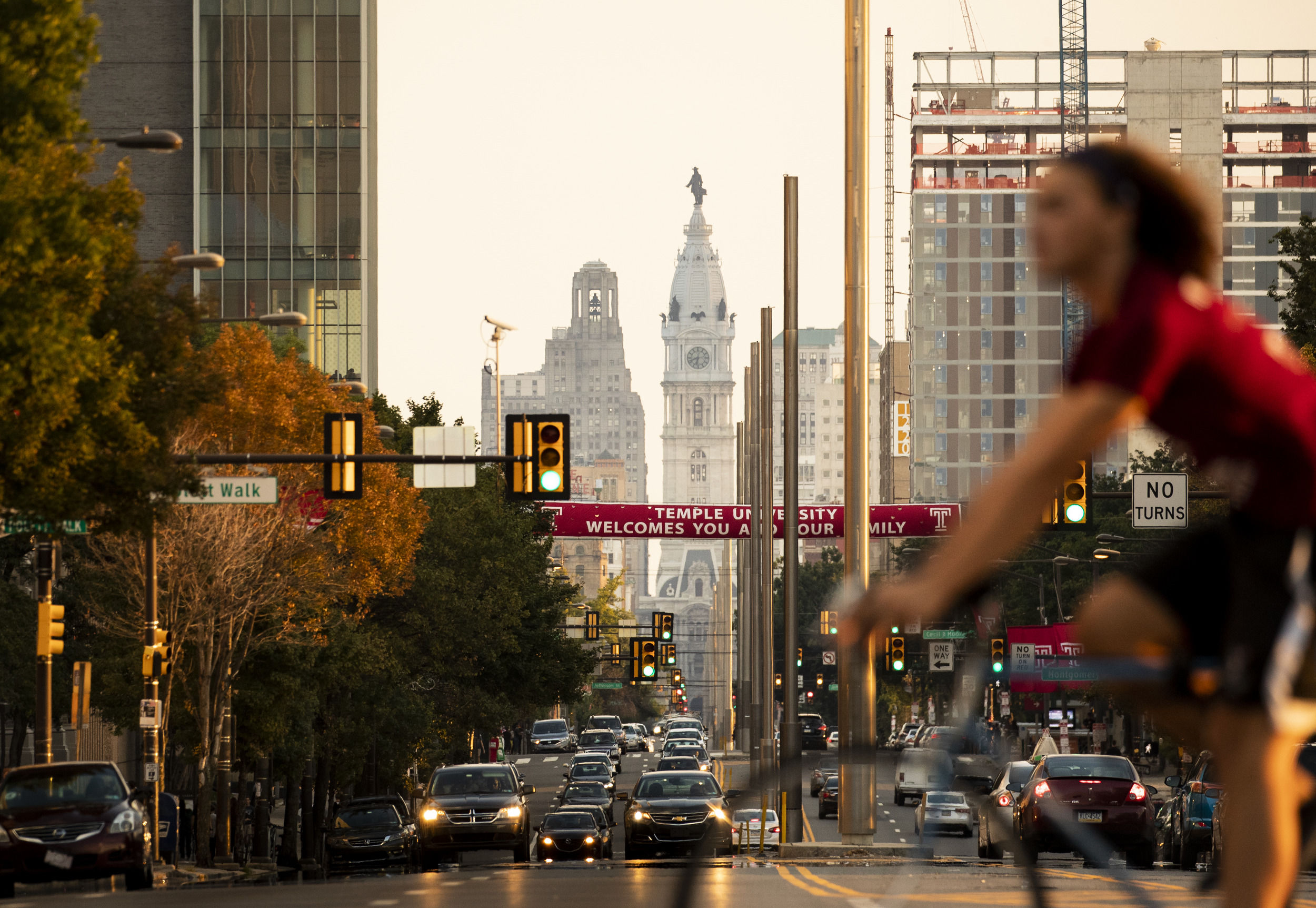 Students and cars crossing Broad Street near Main Campus.