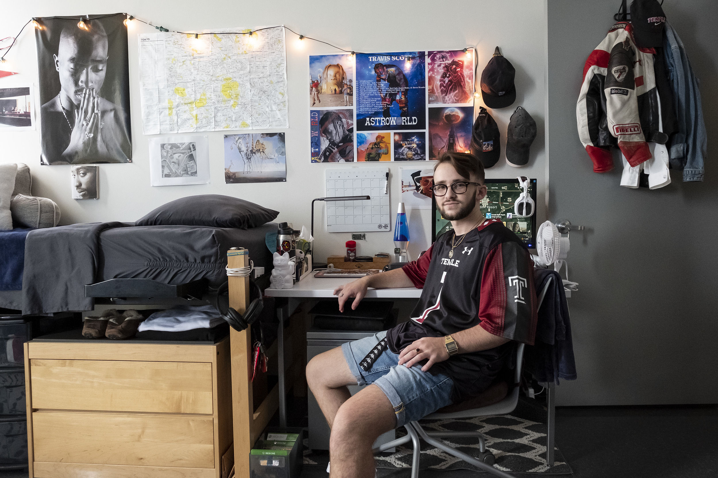 A student sits in their newly decorated room at Temple University.