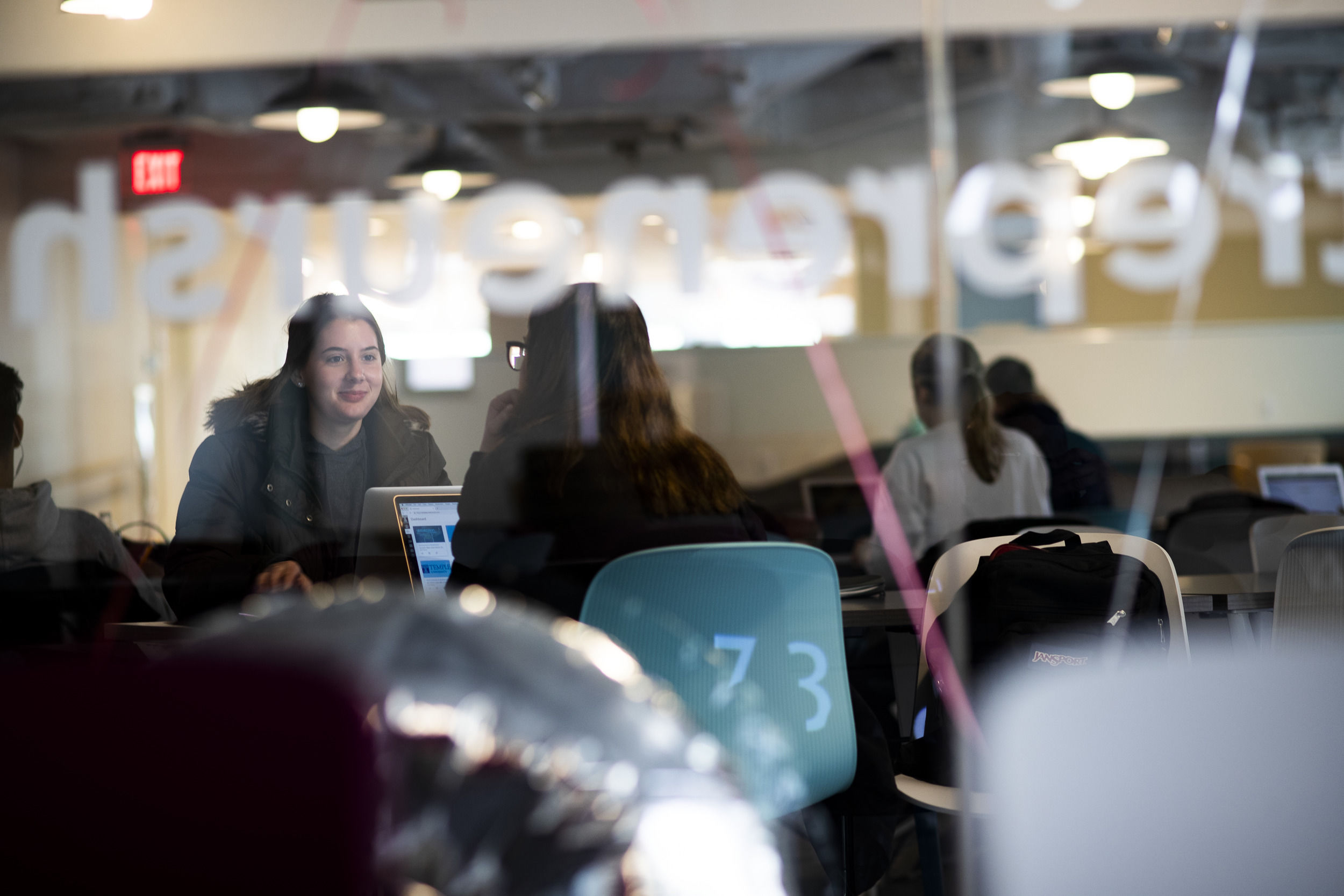 Business students collaborating in a study space.