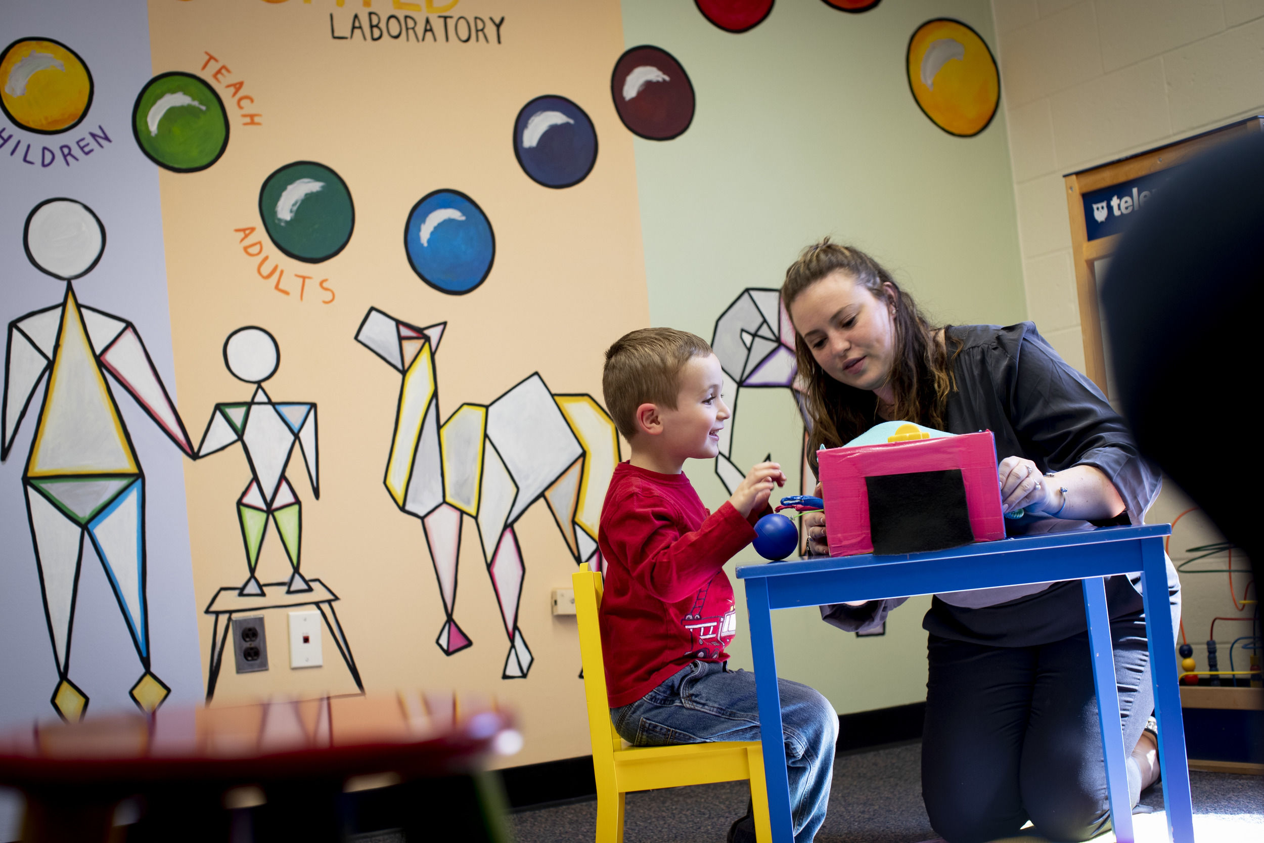 Student teacher working with an elementary student. 