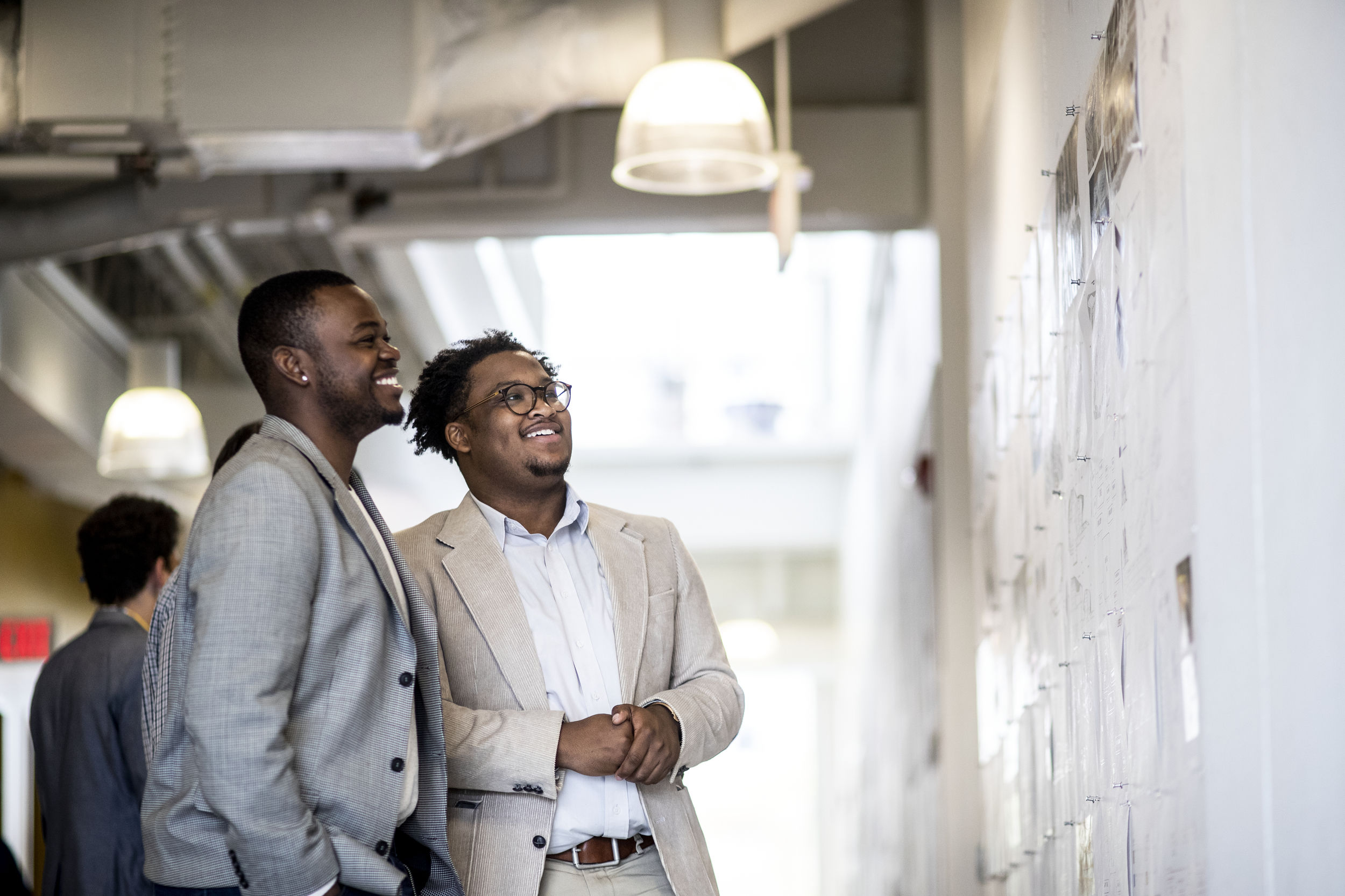 Architecture professor and student talk during class.