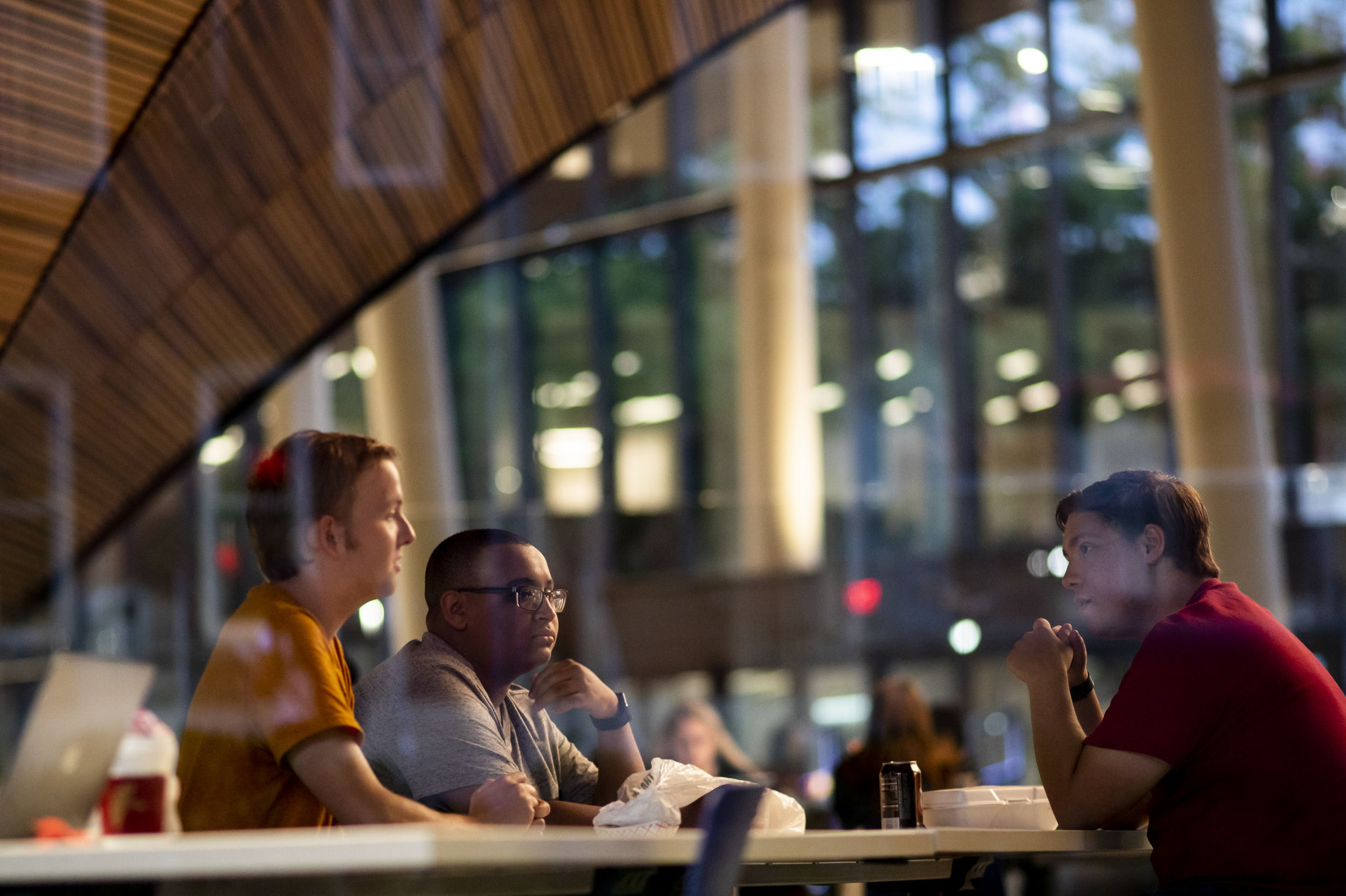 Students participating in an evening study session in Charles Library.