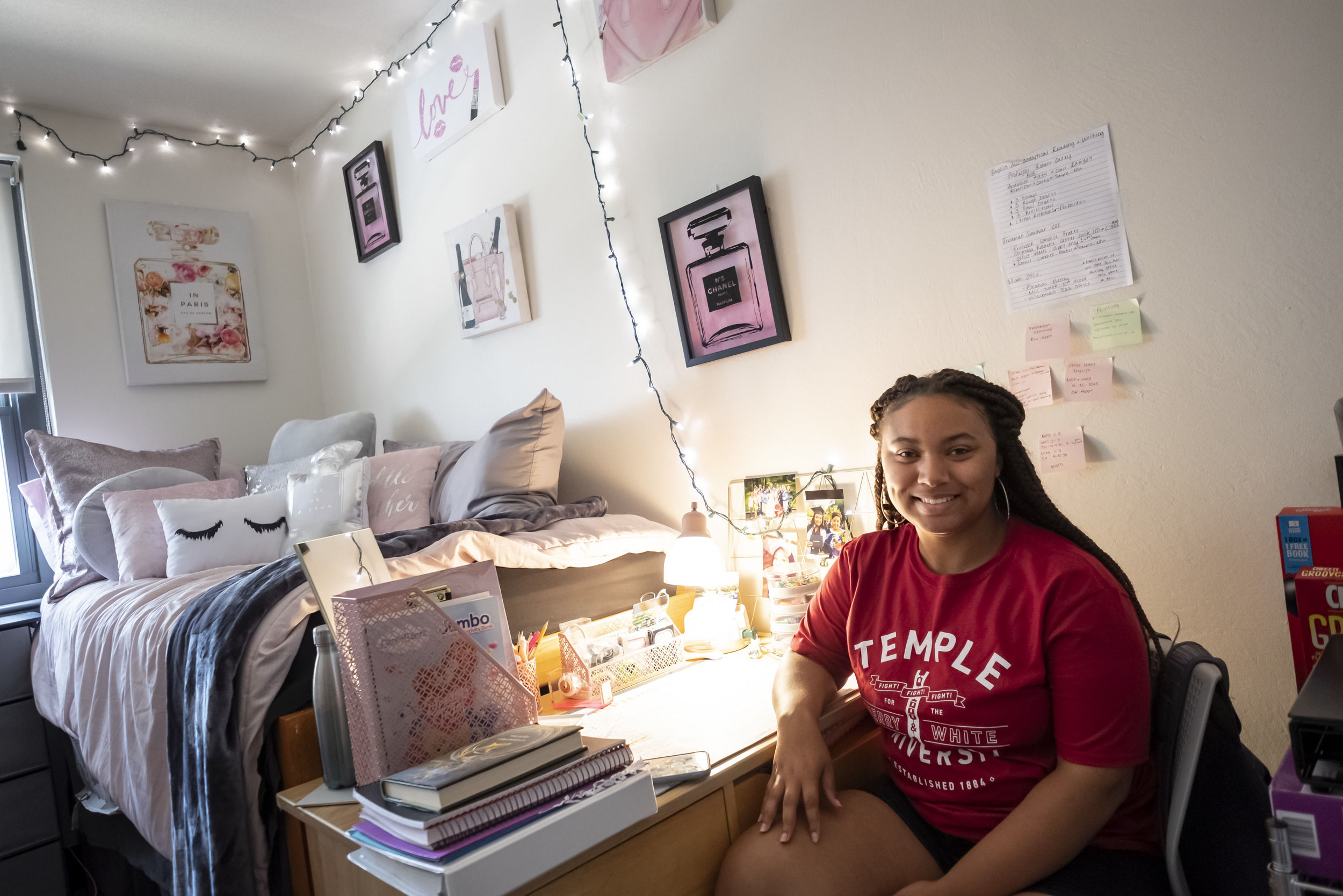 A student sits in their newly decorated room at Temple University.