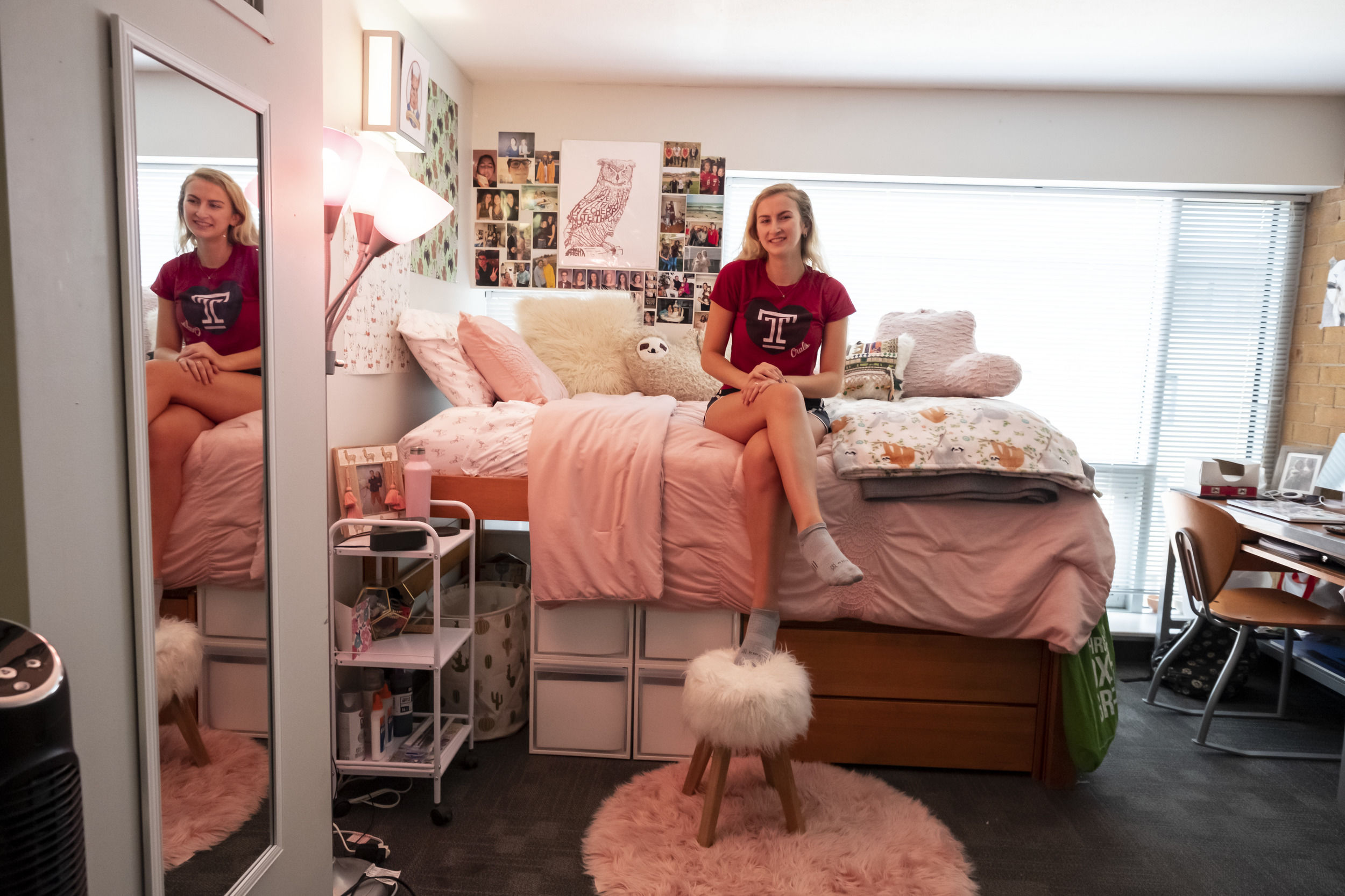 A student sits in their newly decorated room at Temple University.