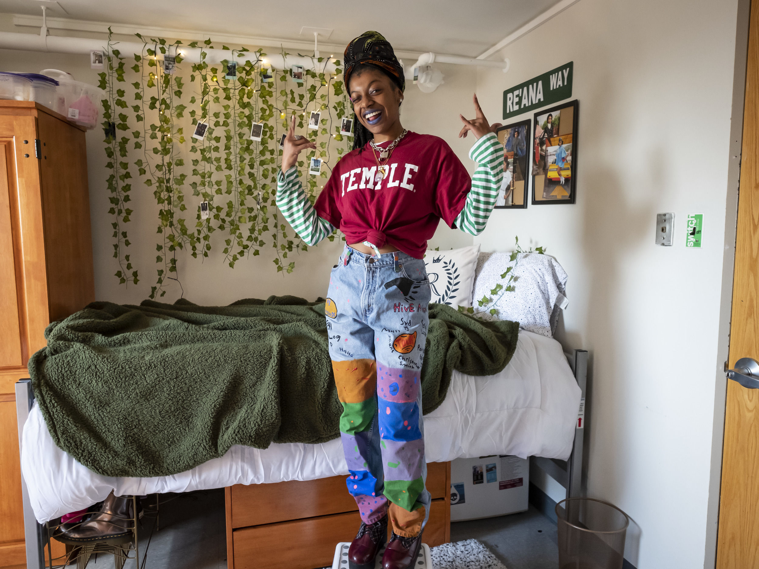 A student sits in their newly decorated room at Temple University.