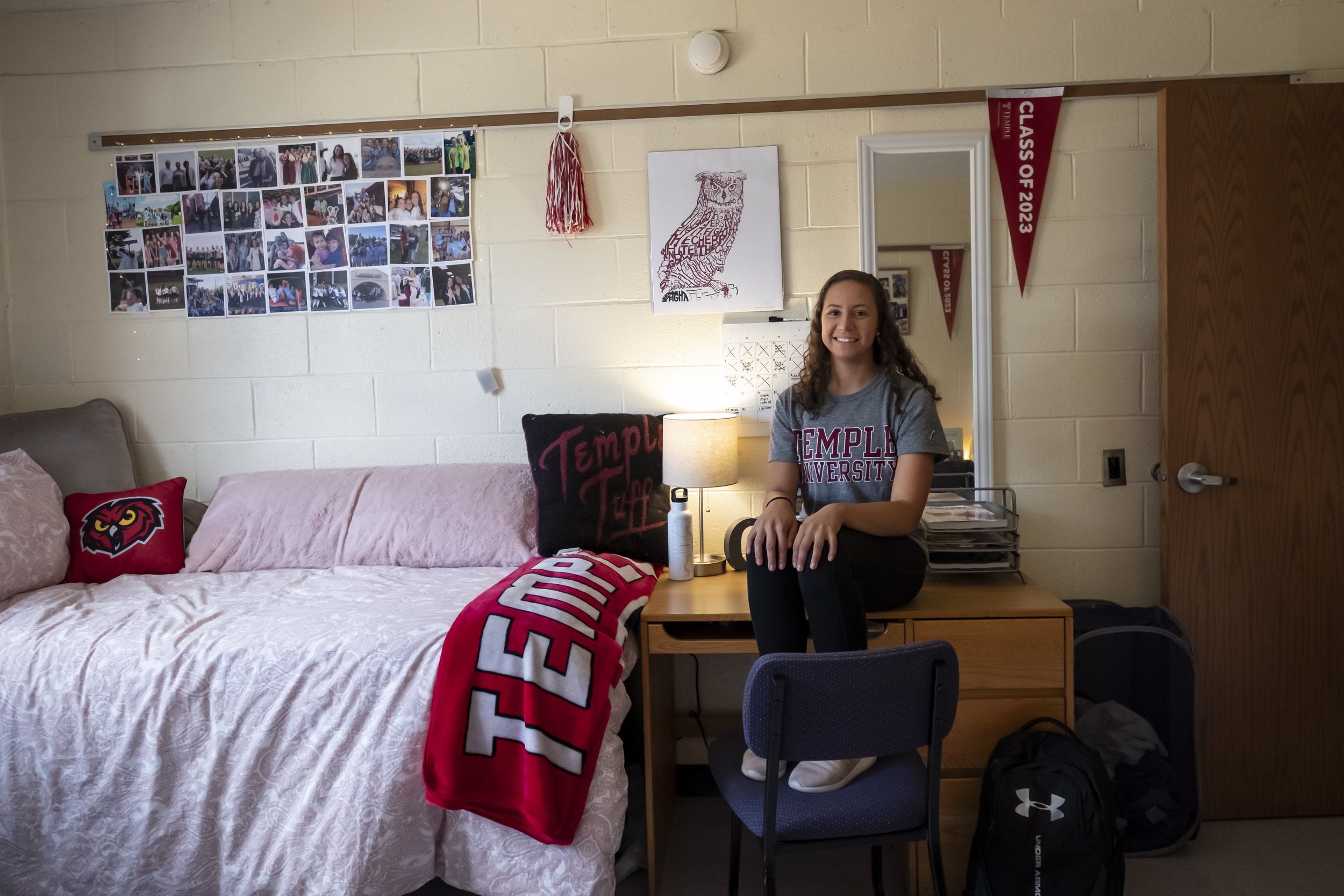 A student sits in their newly decorated room at Temple University.