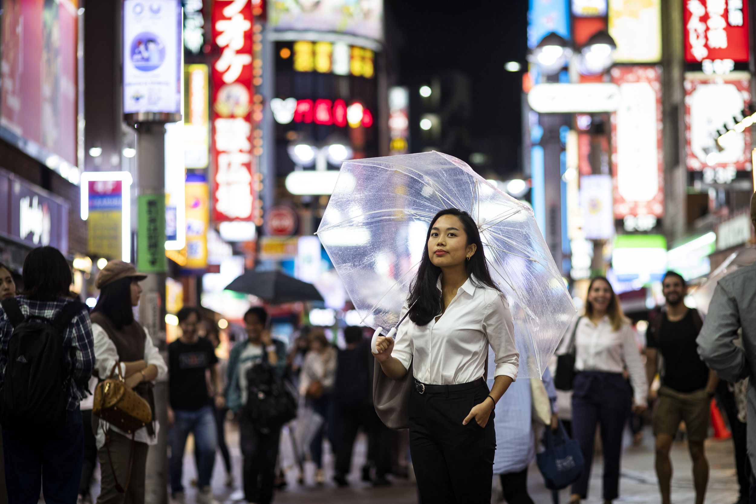 A shot of a student walking through Tokyo.