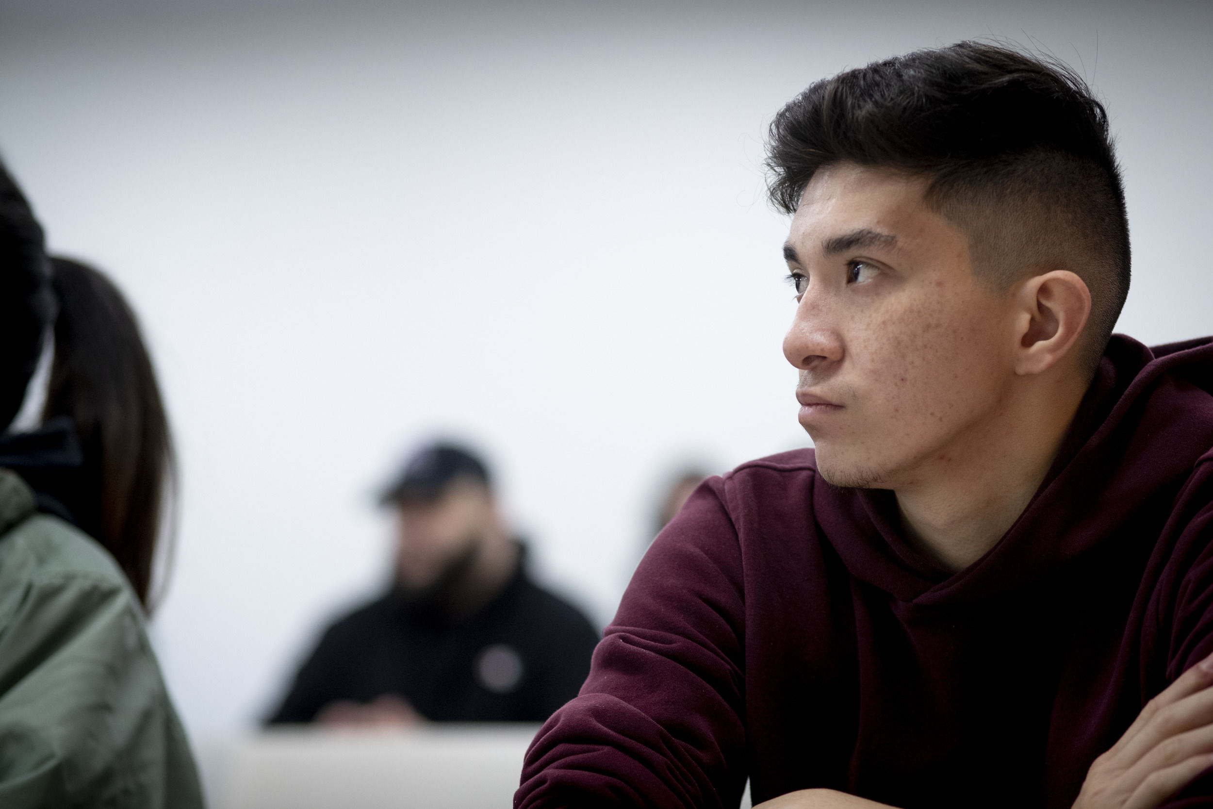 A Klein College of Media and Communications student listens to a lecture during an advertising class.