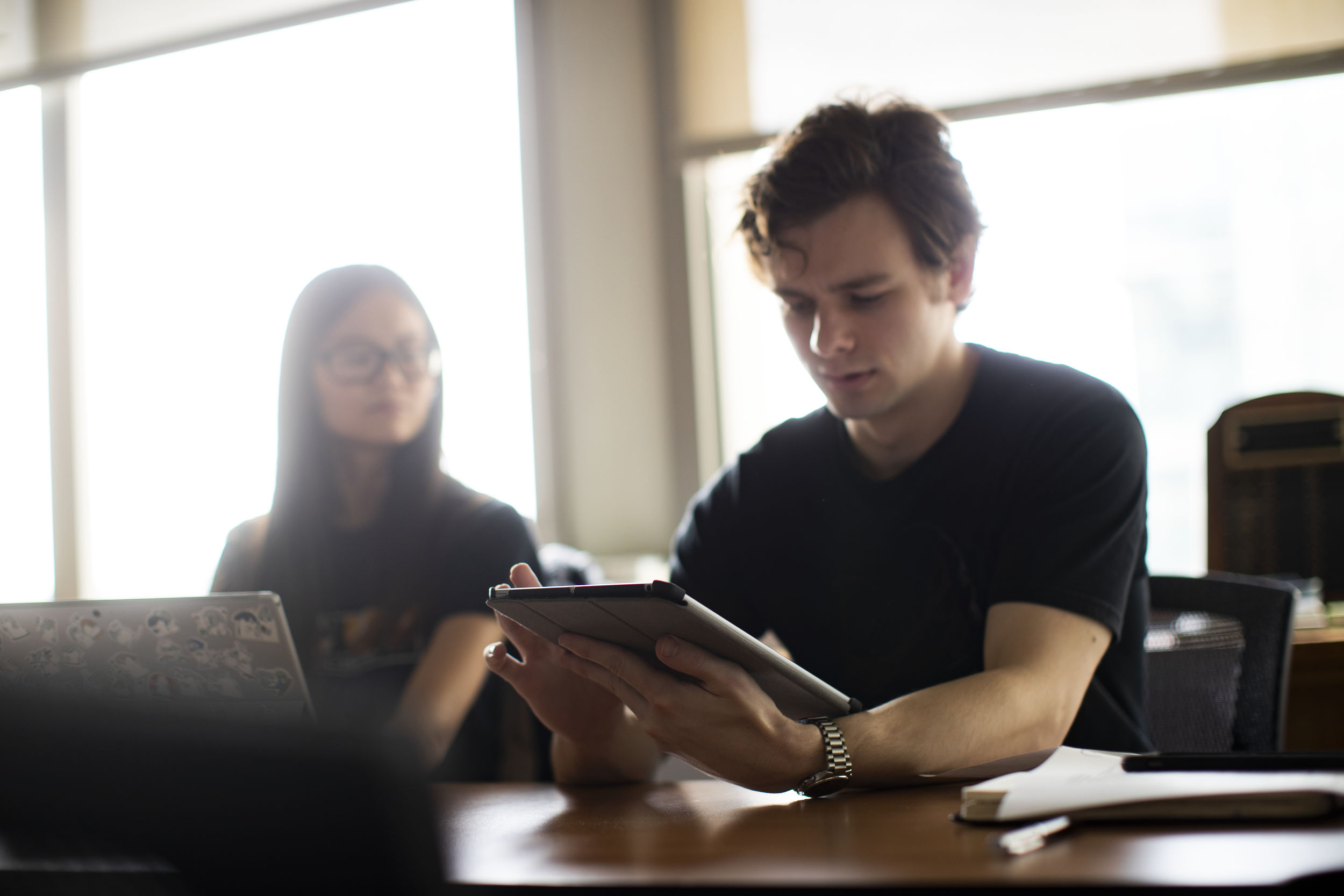 Students collaborate during a meeting of Diamond Edge Communications, Temple’s student-run advertising agency.