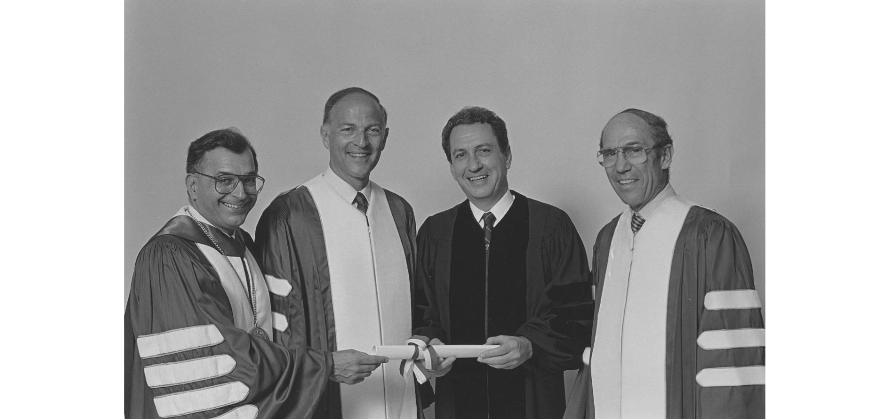 Temple University commencement ceremony for the graduating class of 1986. From left to right: President Peter J. Liacouras, Edward H. Rosen, Arlen Specter, and Richard J. Fox.