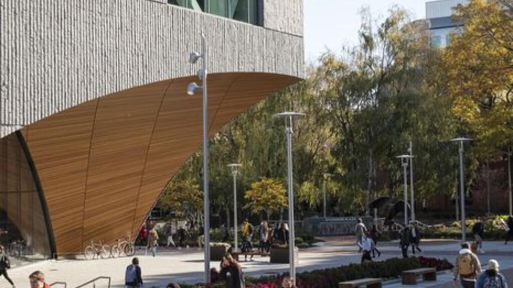 Students walking past Charles Library