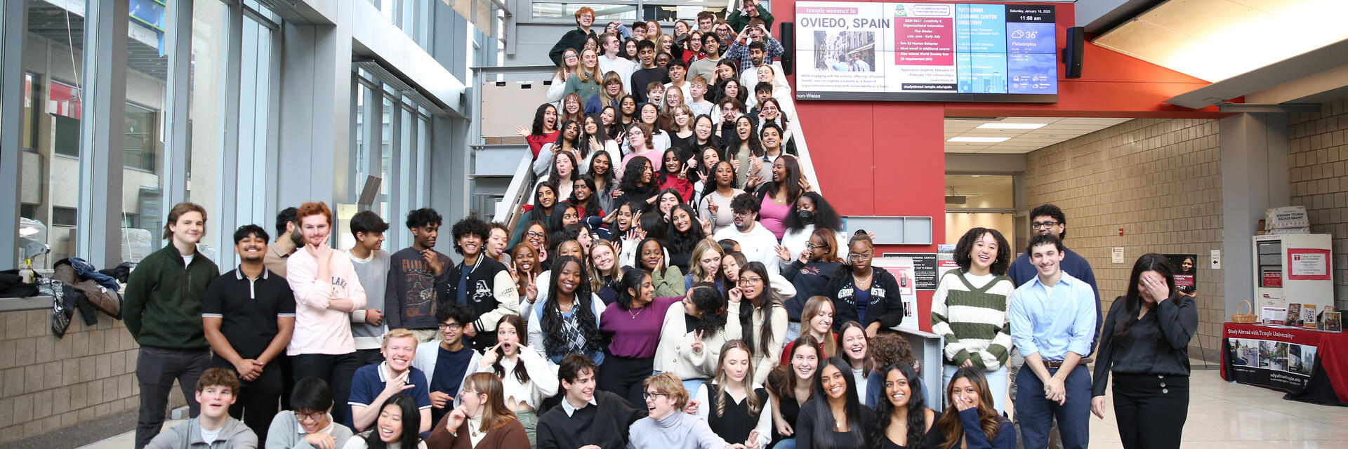 a group of Honors student ambassadors posing on the stairs