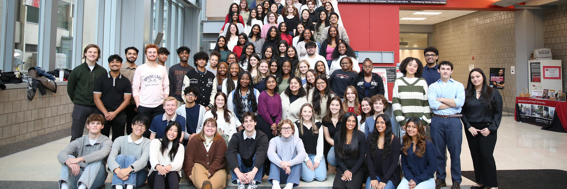 a group of Honors Ambassadors sitting on the steps