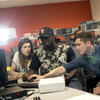 Students working together on a computer.