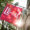 The cherry red Temple T flag flying on Main Campus