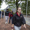Tour guide walking with group.
