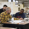 Tyler faculty works with students on Flower Show design. 