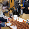 Students painting terracotta pots