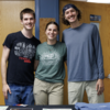 Three students smiling for a photo