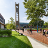 Students walking by the bell tower on their way to class.