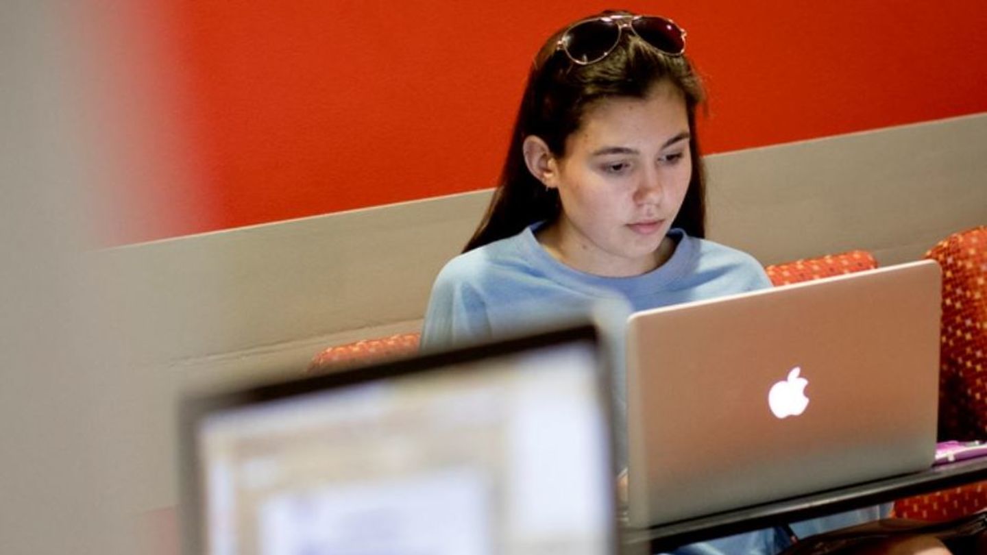  a student using social media at the TECH center